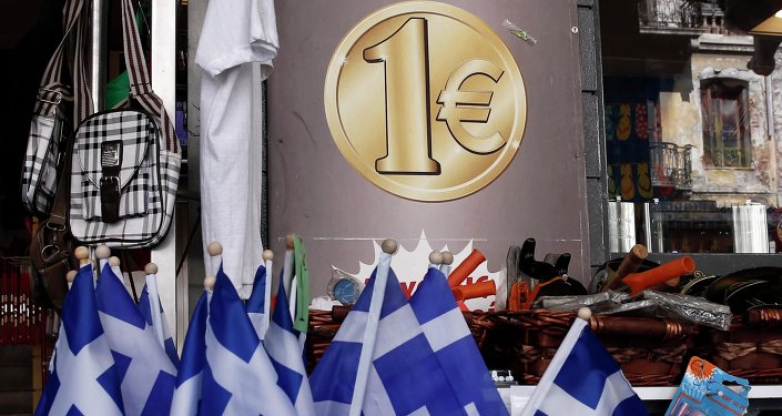 Greek national flags are displayed for sale at the entrance of a one Euro shop in Athens