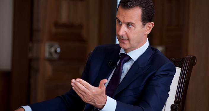 In this photo released on July 1, 2016, by the Syrian official news agency SANA, Syrian President Bashar Assad speaks during an interview with Australia's SBS news channel, in Damascus, Syria
