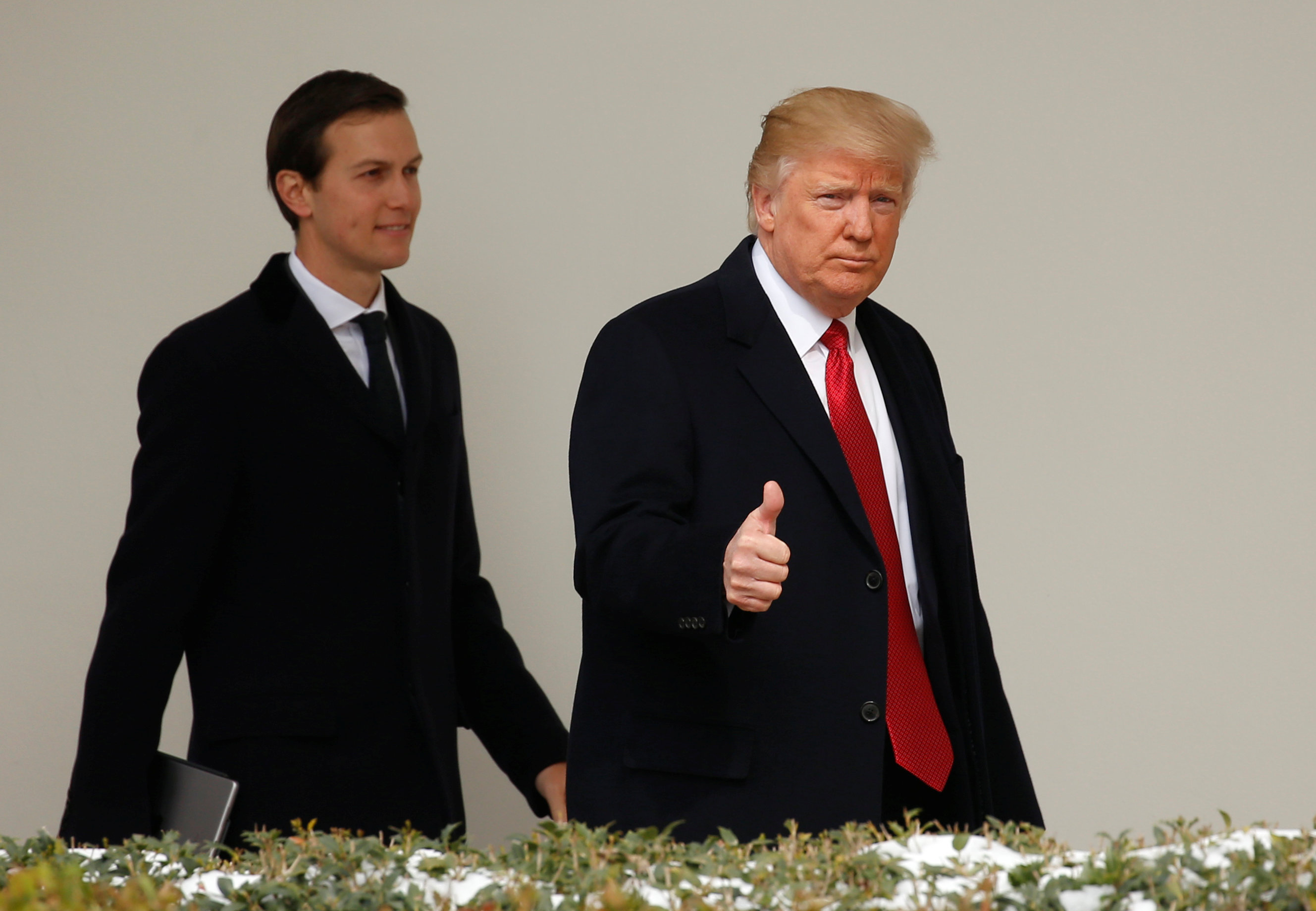 U.S. President Donald Trump gives a thumbs-up as he and White House Senior Advisor Jared Kushner depart the White House in Washington, U.S., March 15, 2017