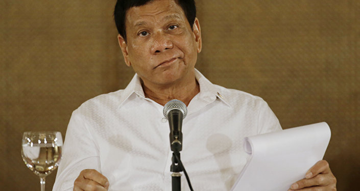 In this Monday, March 13, 2017 file photo, Philippine President Rodrigo Duterte reacts during a press conference at the Malacanang presidential palace in Manila, Philippines.