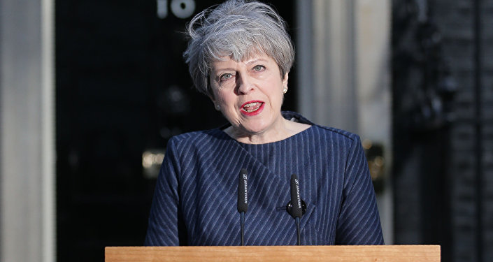 British Prime Minister Theresa May speaks to the media outside 10 Downing Street in central London on April 18, 2017.