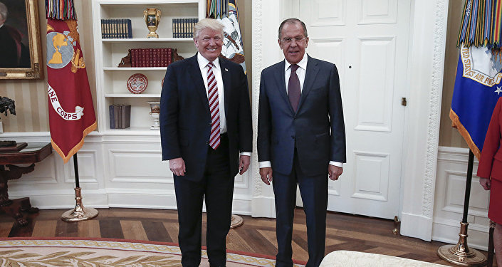 A handout photo made available by the Russian Foreign Ministry on May 10, 2017 shows US President Donald J. Trump (L) posing with Russian Foreign Minister Sergei Lavrov during a meeting at the White House in Washington, DC.