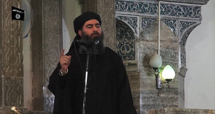 This July 5, 2014 photo shows an image grab taken from a propaganda video released by al-Furqan Media allegedly showing the leader of the Islamic State (IS) jihadist group, Abu Bakr al-Baghdadi, aka Caliph Ibrahim, adressing Muslim worshippers at a mosque in the militant-held northern Iraqi city of Mosul