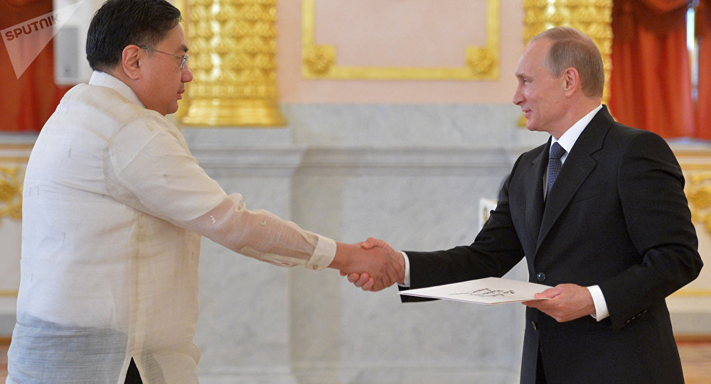 May 28, 2015. Russian President Vladimir Putin (right) and Ambassador Extraordinary and Plenipotentiary of the Republic of the Phillipines to the Russian Federation Carlos Sorreta are in the Alexander Hall of the Grand Kremlin Palace during the ceremony of presenting credentials by new ambassadors of some foreign countries.