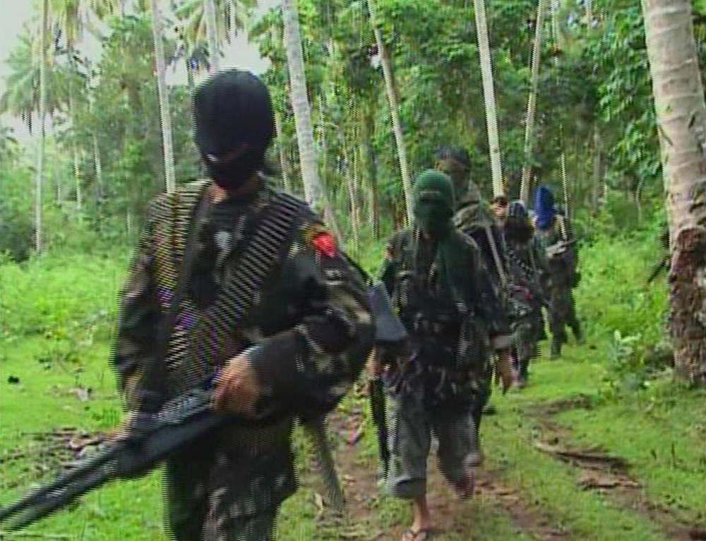Abu Sayyaf rebels in the interior of the southern Philippine Jolo island in a file photo. Photo: Reuters/Philippine National Red Cross via Reuters TV 