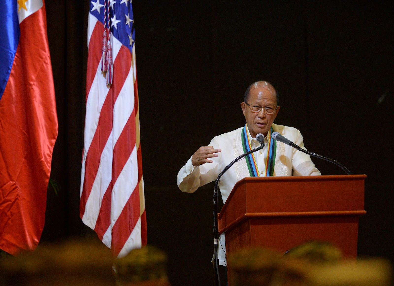 Philippines' Defense Secretary Delfin Lorenzana gestures as he delivers a speech during the closing ceremony of the annual joint US-Philippines military exercise in Manila on May 19, 2017. The Philippines and the United States launched annual military exercises on May 8 but the longtime allies scaled them down  which focuses only on counter-terrorism and disaster relief in line with President Rodrigo Duterte's pivot to China and Russia. / AFP PHOTO / TED ALJIBE