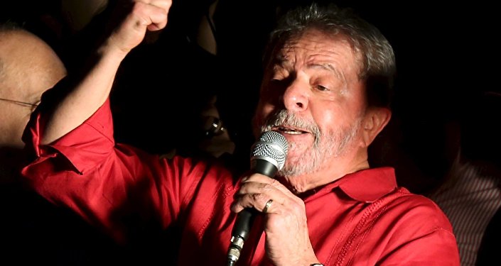 Brazilian President Luiz Inacio Lula da Silva gestures during a demonstration in support of Brazil's President Dilma Rousseff's appointment of him as her chief of staff, at Paulista avenue in Sao Paulo, Brazil