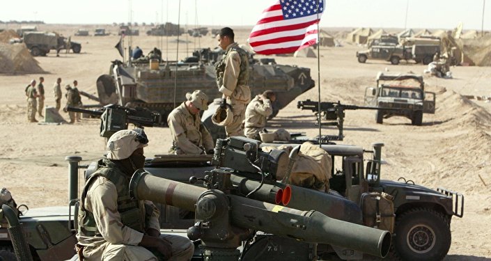 American marines of the USMC (US Marine Corps) put a flag on a antenna of a HMMWI (Hight Mobility Multi Wheeled Vehicles) in the north of the desert Kuwait near the Iraqi border 15 March 2003