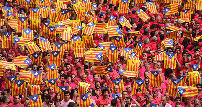 People showing 'Esteladas' (pro-independence Catalan flags) during the XXVI human towers, or 'castells', competetion in Tarragona on October 2, 2016.