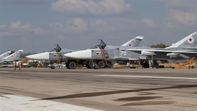 A general view shows Russian fighter jets on the tarmac at the Hmeimim military base in Latakia province, in the northwest of Syria, on February 16, 2016. (Photo by AFP)