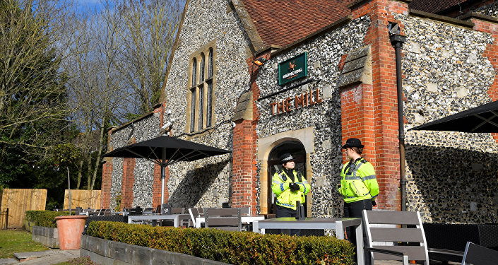 Police officers stand outside a pub near to where former Russian inteligence officer Sergei Skripal, and his daughter Yulia were found unconscious after they had been exposed to an unknown substance, in Salisbury, Britain, March 7, 2018