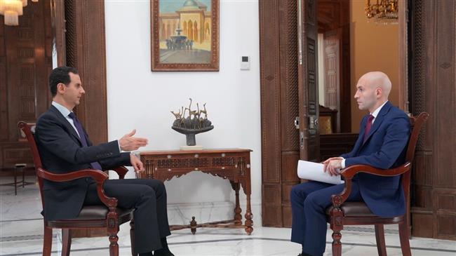 The photo shows Syria’s President Bashar al-Assad speaking during an interview with Russia's RT on May 31, 2018.