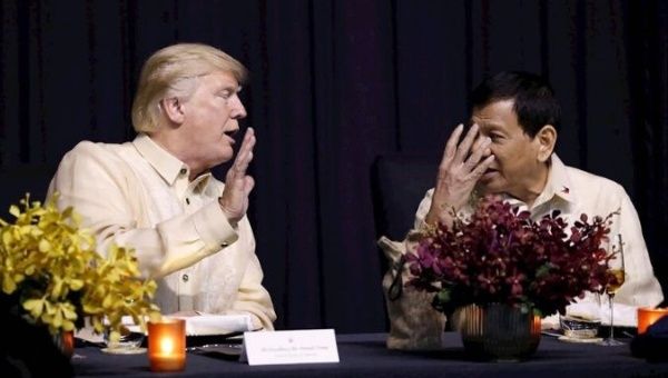 U.S. President Trump talks with Philippines President Rodrigo Duterte during the gala dinner marking ASEAN's 50th anniversary in Manila, Philippines. 