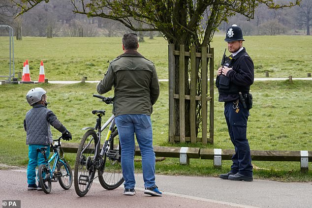 Cyclists, even children, pictured today in London's Richmond Park, have been spoken to by police officers amid the coronavirus lockdown