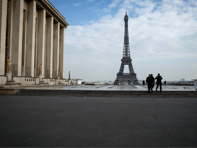 Policemen patrol on the Esplanade du Trocadero square near the Eiffel Tower in Paris, on March 17, 2020 in Paris as a strict lockdown comes into in effect in France to stop the spread of COVID-19, caused by the novel coronavirus. - A strict lockdown requiring most people in France …