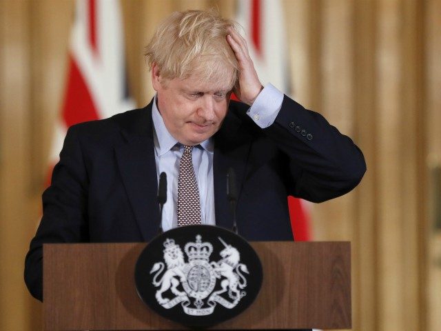 Britain's Prime Minister Boris Johnson reacts during a press conference at 10 Downing Street in London on March 3, 2020 to unveil government planning to combat coronavirus. - The government published their plans for measures to tackle the spread of coronavirus in the UK. (Photo by Frank Augstein / POOL …