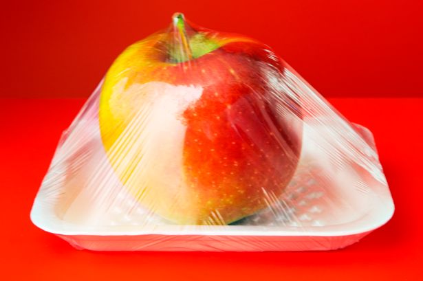 Apple in plastic